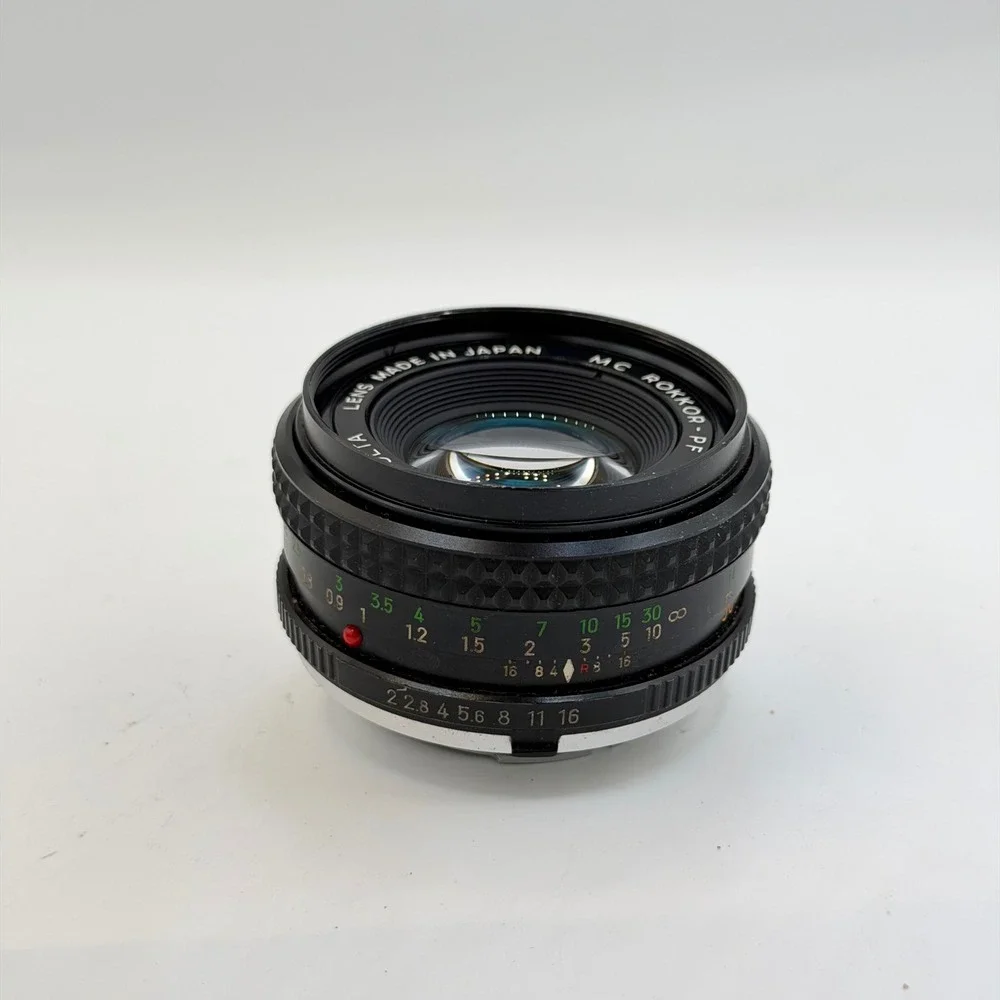 Minolta MC Rokkor-PF 50mm f/2 Lens with 55mm Skylight 1A Hood SR Mount 1126884